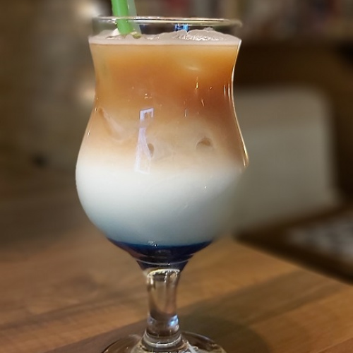 Cold coffee cocktail with caramel syrup
